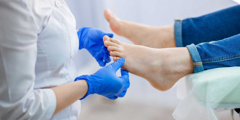 A podiatrist treating feet