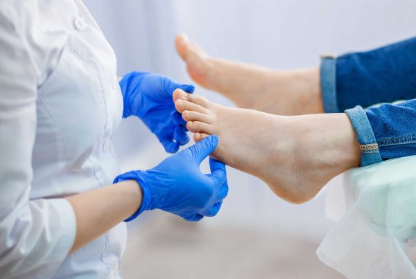 A podiatrist treating feet