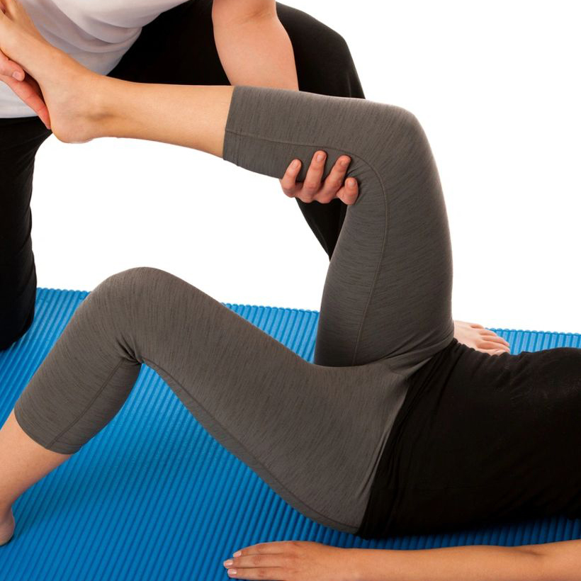 A Physiotherapist working on leg movements