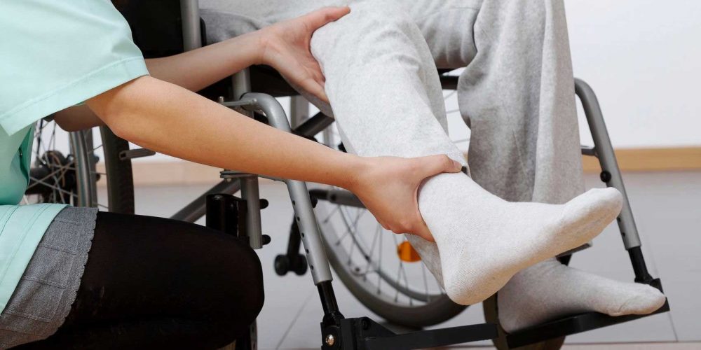 An occupational therapist prescribing wheelchair adjustments